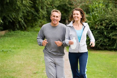 run 40s couple - Mature couple jogging Stock Photo - Premium Royalty-Free, Code: 614-02679679