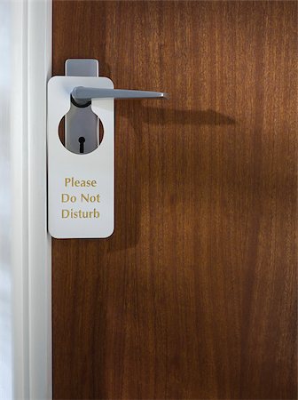 Ne pas déranger signe sur une porte de chambre d'hôtel Photographie de stock - Premium Libres de Droits, Code: 614-02680065