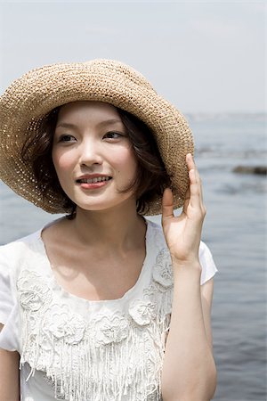 Young woman by the sea Stock Photo - Premium Royalty-Free, Code: 614-02680949