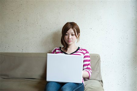 simsearch:614-02985277,k - Young woman with laptop Stock Photo - Premium Royalty-Free, Code: 614-02681101