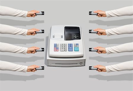 Cash register and people with credit cards Stock Photo - Premium Royalty-Free, Code: 614-02739549