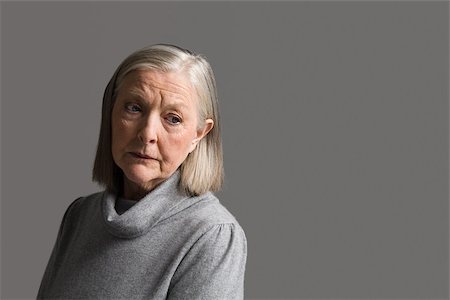 senior sad - Senior woman looking worried Stock Photo - Premium Royalty-Free, Code: 614-02739944