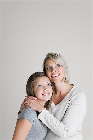 family studio shot - Mother and daughter looking up Stock Photo - Premium Royalty-Free, Code: 614-02739943