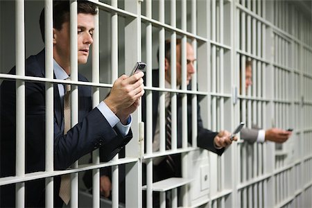 prisoner - Businessmen in jail Stock Photo - Premium Royalty-Free, Code: 614-02739975