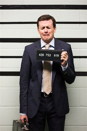 suspect - Mugshot of businessman Stock Photo - Premium Royalty-Free, Code: 614-02739970