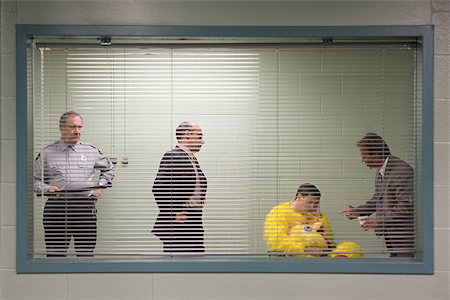 police detective standing - Man in chicken suit in police interview Foto de stock - Sin royalties Premium, Código: 614-02739995