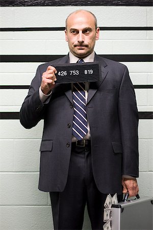 estación de policía - Mugshot of businessman Foto de stock - Sin royalties Premium, Código: 614-02740045