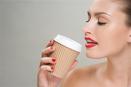 paper cup - Woman drinking coffee from a paper cup Stock Photo - Premium Royalty-Free, Code: 614-02740402