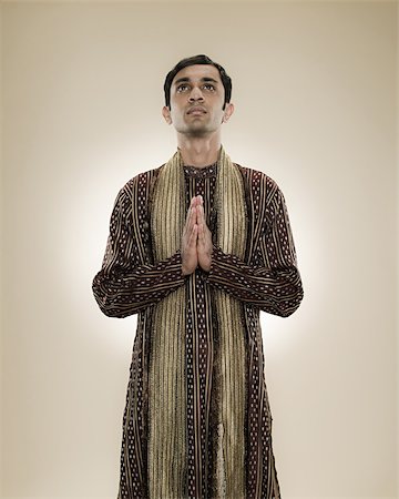 A hindu man praying Fotografie stock - Premium Royalty-Free, Codice: 614-02764130