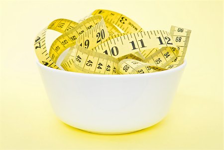 simsearch:640-02949943,k - A tape measure in a bowl Stock Photo - Premium Royalty-Free, Code: 614-02764245