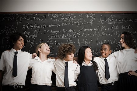 pictures of african american high school students - Students in front of blackboard Stock Photo - Premium Royalty-Free, Code: 614-02762648