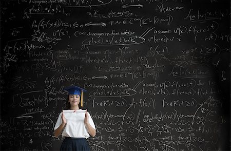 smart asian math - Graduating girl in front of blackboard Stock Photo - Premium Royalty-Free, Code: 614-02762787