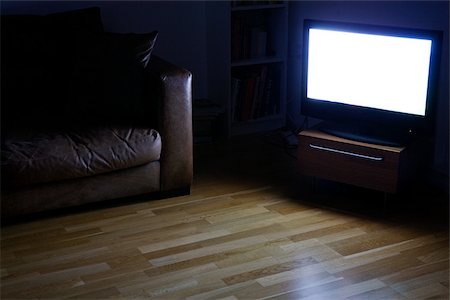 A tv on in a living room Stock Photo - Premium Royalty-Free, Code: 614-02763148