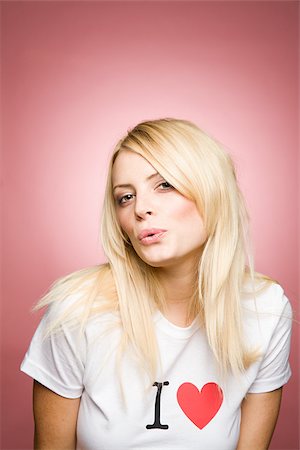 A young woman pouting Stock Photo - Premium Royalty-Free, Code: 614-02763670