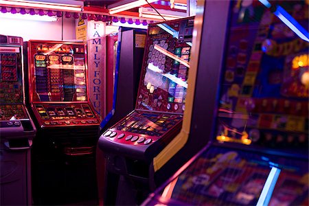 Slot machines in amusement arcade Stock Photo - Premium Royalty-Free, Code: 614-02763768