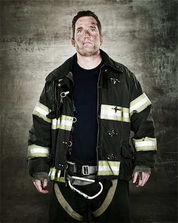 firefighter dirty face - Portrait of a firefighter Stock Photo - Premium Royalty-Free, Code: 614-02763965