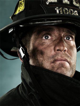 firefighter dirty face - Portrait of a firefighter Stock Photo - Premium Royalty-Free, Code: 614-02763985