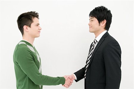 Businessmen shaking hands Stock Photo - Premium Royalty-Free, Code: 614-02838170