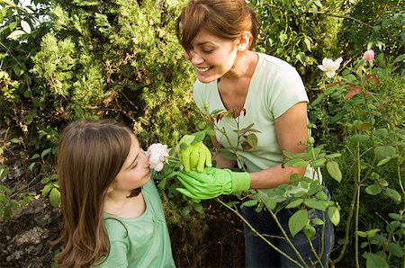 family backyard gardening not barbeque - Mother and daughter in garden Stock Photo - Premium Royalty-Free, Code: 614-02838259