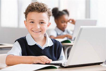 portuguese - Schoolboy with laptop Stock Photo - Premium Royalty-Free, Code: 614-02838379