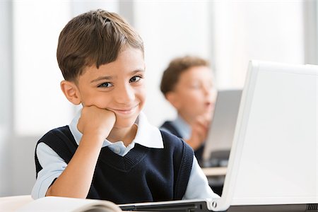 portuguese - Schoolboy in class Stock Photo - Premium Royalty-Free, Code: 614-02838383