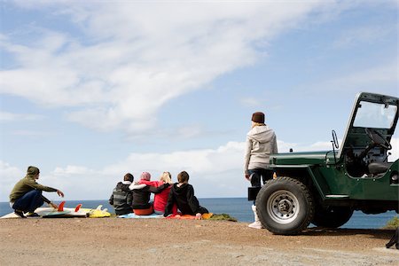 Teenagers at the coast with off road vehicle Stock Photo - Premium Royalty-Free, Code: 614-02838520