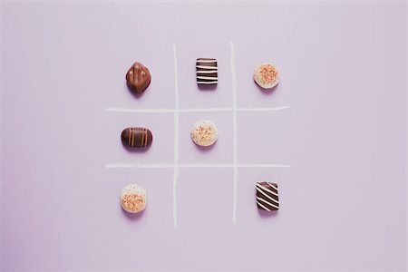 simsearch:614-02838633,k - Chocolates on grid Stock Photo - Premium Royalty-Free, Code: 614-02838595