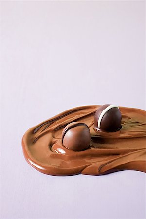 Chocolates in melted chocolate Stock Photo - Premium Royalty-Free, Code: 614-02838617