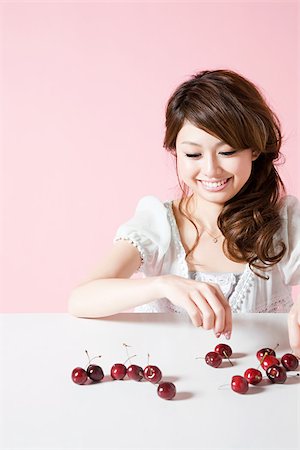 simsearch:614-02838643,k - Woman with cherries Stock Photo - Premium Royalty-Free, Code: 614-02838625