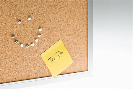 post it - Happy face on notice board Stock Photo - Premium Royalty-Free, Code: 614-02838777