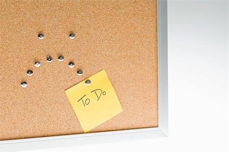 push pin reminder - Sad face on notice board Stock Photo - Premium Royalty-Free, Code: 614-02838778