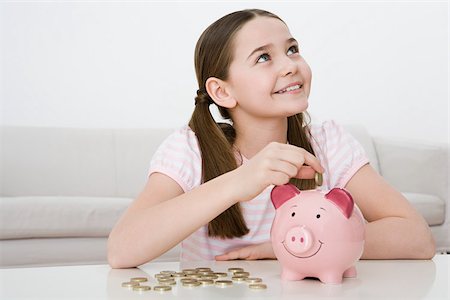 Young girl with piggy bank Foto de stock - Sin royalties Premium, Código: 614-02934169
