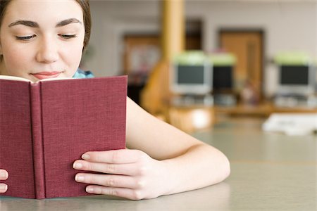 Girl reading a book Stock Photo - Premium Royalty-Free, Code: 614-02934520