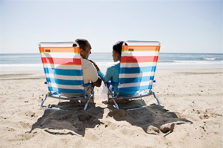 simsearch:614-03784139,k - Couple relaxing on a beach Stock Photo - Premium Royalty-Free, Code: 614-02934569