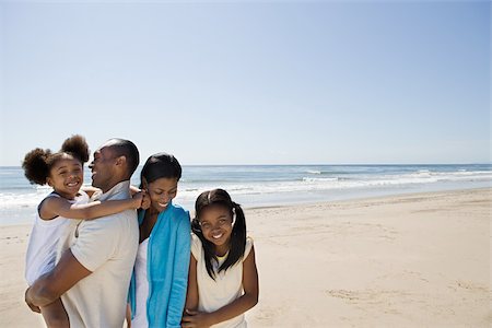 African american family on a beach Stock Photo - Premium Royalty-Free, Code: 614-02934587