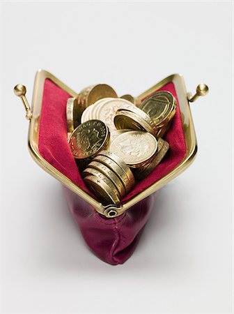 Pound coins in a purse Stock Photo - Premium Royalty-Free, Code: 614-02934753