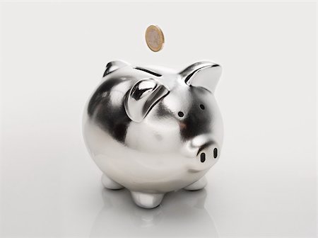 Coin and piggybank Stock Photo - Premium Royalty-Free, Code: 614-02934760