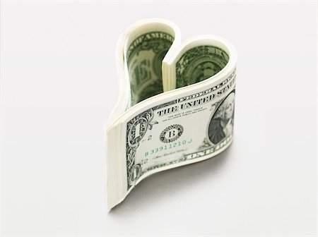 dólar - Dollar bills in heart shape Foto de stock - Sin royalties Premium, Código: 614-02934794