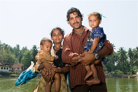 Indian family by communal baths Stock Photo - Premium Royalty-Free, Code: 614-02934835