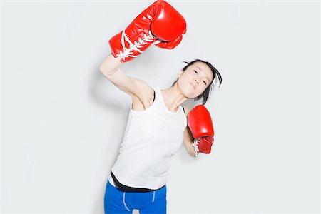 Young woman in boxing gloves Foto de stock - Sin royalties Premium, Código: 614-02935191