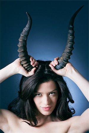 simsearch:614-02935269,k - Young woman with horns Stock Photo - Premium Royalty-Free, Code: 614-02935243