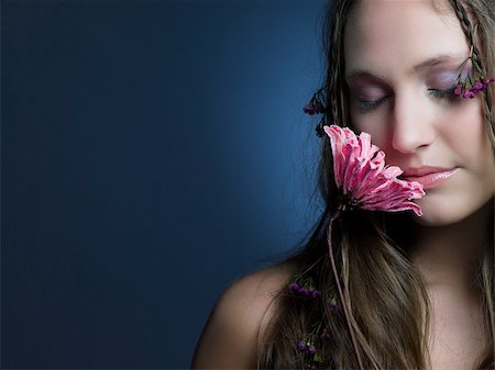 simsearch:614-02935269,k - Young woman with flower Stock Photo - Premium Royalty-Free, Code: 614-02935259