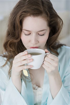 sip of tea - Woman having herbal tea Stock Photo - Premium Royalty-Free, Code: 614-02933921