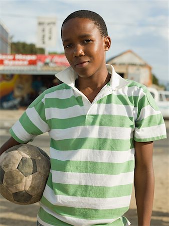 south africa and city - Teenage african boy with football Foto de stock - Sin royalties Premium, Código: 614-02984323