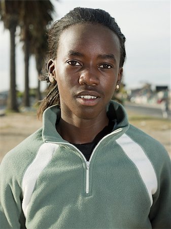 Portrait of a teenage african teenage boy Stock Photo - Premium Royalty-Free, Code: 614-02984343