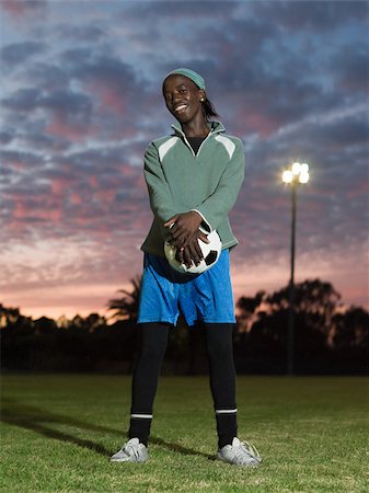 Teenage african boy with football Fotografie stock - Premium Royalty-Free, Codice: 614-02984361
