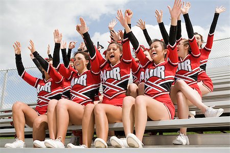 Cheerleaders on bleachers Stock Photo - Premium Royalty-Free, Code: 614-02984825