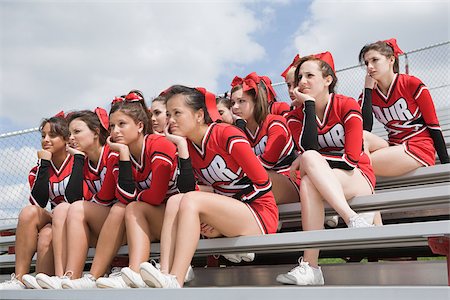 Cheerleaders on bleachers Stock Photo - Premium Royalty-Free, Code: 614-02984870