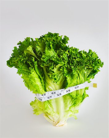 Tape measure around lettuce Foto de stock - Sin royalties Premium, Código: 614-02984898