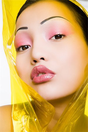 Young woman with plastic around her head Stock Photo - Premium Royalty-Free, Code: 614-02984927